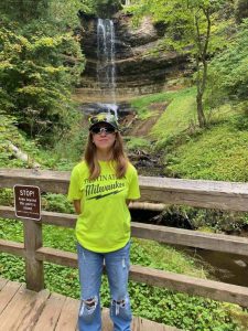 Ava reppin' Destination Milwaukee while visiting Michigan's beautiful Munising Falls